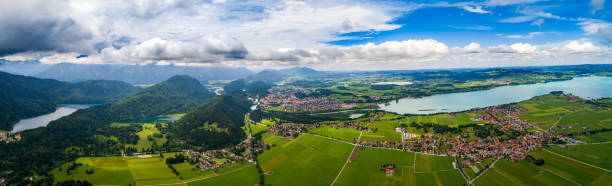 Panorama from the air sunset Forggensee and Schwangau, Germany, Bavaria Panorama from the air sunset Forggensee and Schwangau, Germany, Bavaria forggensee lake photos stock pictures, royalty-free photos & images