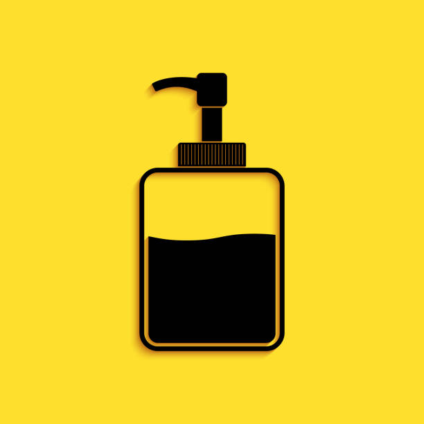 istock Black Hand sanitizer bottle icon isolated on yellow background. Disinfection concept. Washing gel. Alcohol bottle for hygiene. Long shadow style. Vector 1268255892