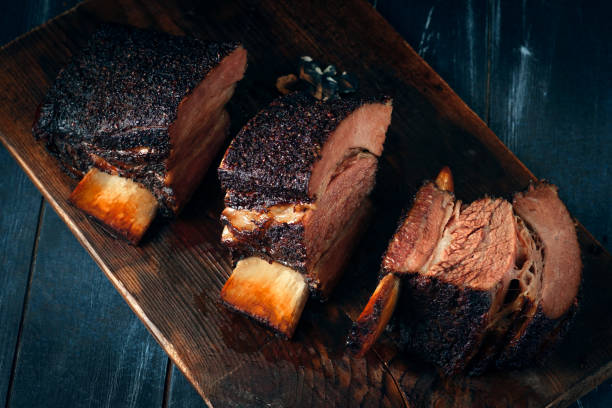 istock Chopping board with Smoked beef brisket ribs, Classic Texas BBQ 1268258180