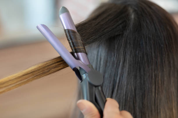 istock Hairdresser making a hairstyle 1268259464