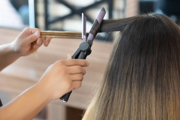 istock Hairdresser making a hairstyle 1268259502