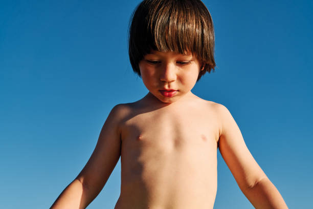 istock Cute child on beach at sunny day 1268261660