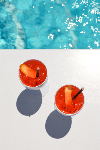 Fruity cocktail aperol spritzer by the pool
