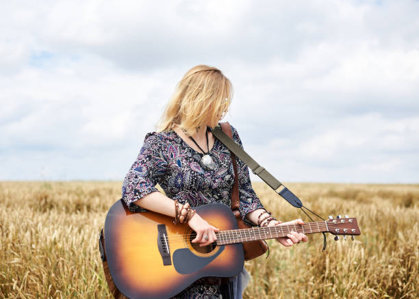 istock Hippie women on wheat filed 1268262125