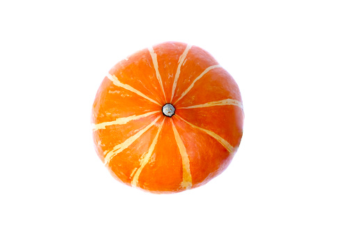 Orange pumpkin on a white isolated background. Close-up, top view. Background for your Halloween illustrations or lettering.