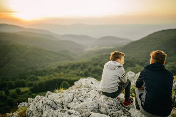 istock Two brother resting after hiking 1268263424