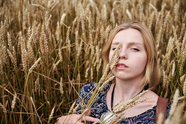 istock Hippie women on wheat filed 1268263728
