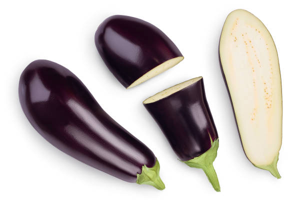 istock Eggplant or aubergine with slices isolated on white background. Clipping path and full depth of field. top, view, flat lay 1268265877