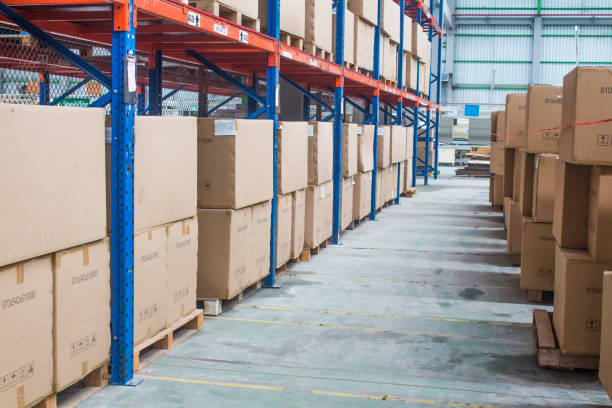 istock interior of warehouse. Rows of shelves with boxes 1268266156