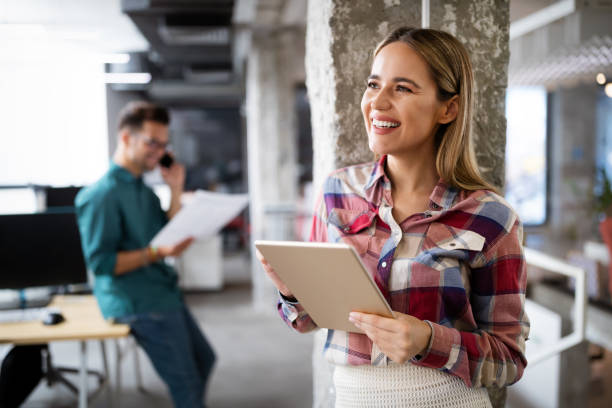 istock Creative brainstorming. Happy business people, designers, architects working as a team in office 1268268381
