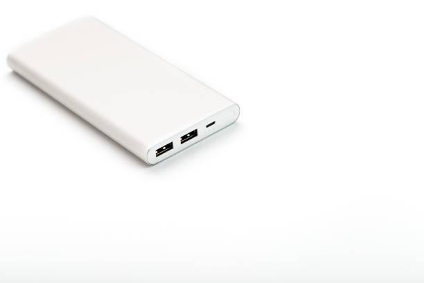 istock Power Bank for charging your smartphone on a white background. Universal external battery for gadgets free space and minimalistic composition. 1268269215