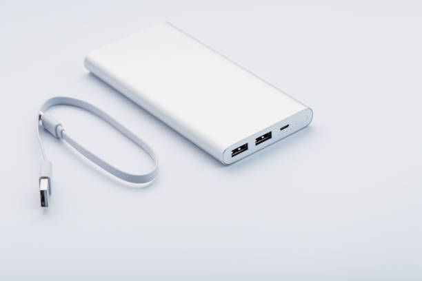 istock Powerbank for charging mobile devices with cable, on a white background. 1268269755