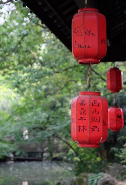 istock traditional chinese red anterns hanging under eave 1268270499