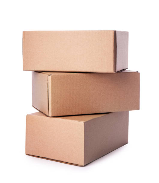 istock Closed cardboard boxes isolated on white background. Carton delivery packaging, three recycling brown box 1268273055