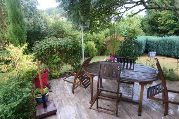 istock Rainy weather  Table on the garden terrace  Folded chairs  Meteorology 1268273129