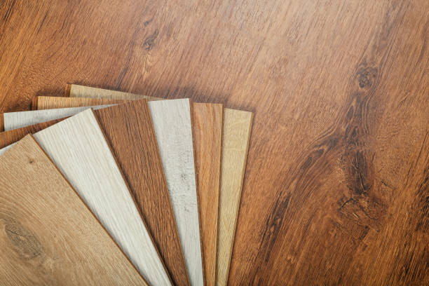 istock Laminate background. Samples of laminate or parquet with a pattern and wood texture for flooring and interior design. Production of wooden floors 1268273247
