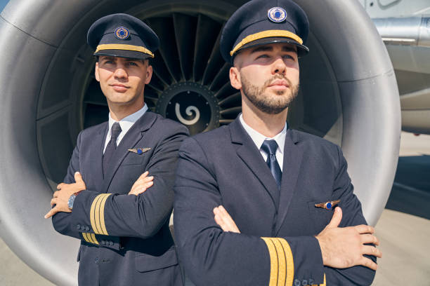 istock Two Caucasian airmen standing by the aircraft 1268273467