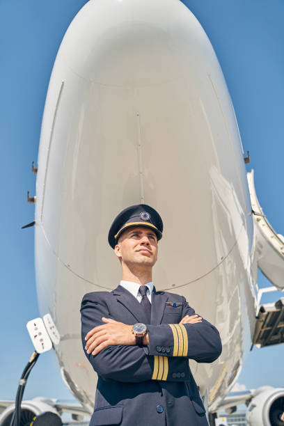 istock Handsome serene pilot looking into the distance 1268273472
