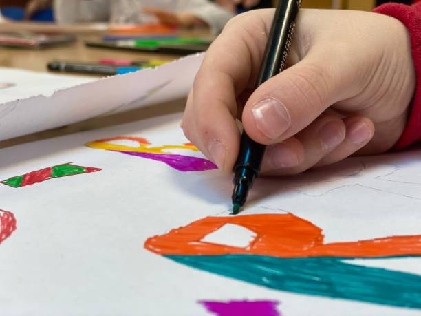 istock The child paints with a felt-tip pen 1268273505