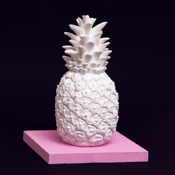 istock White painted pineapple  in geometry space. Minimal creative art 1268273556