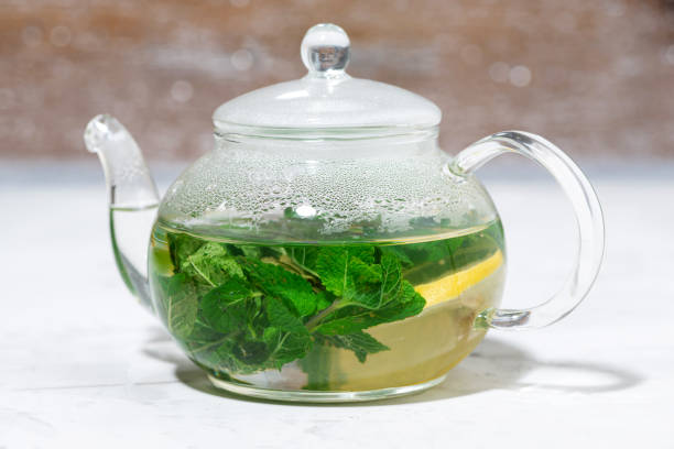 istock fresh mint tea in a glass teapot, closeup 1268283645