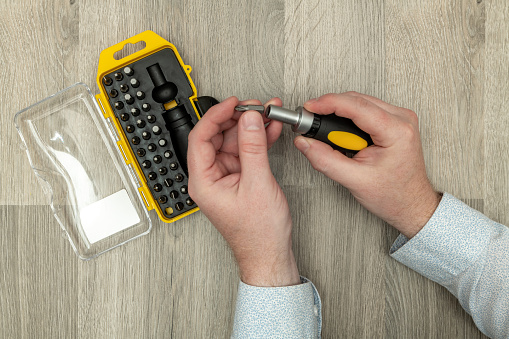 Putting in a screwdriver bit from a selection