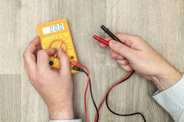 Using a digital electronic multimeter Tool Using a digital electronic multimeter Tool multimeter stock pictures, royalty-free photos & images