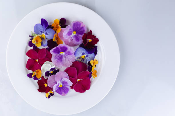 istock Edible flowers on a plate 1268286798