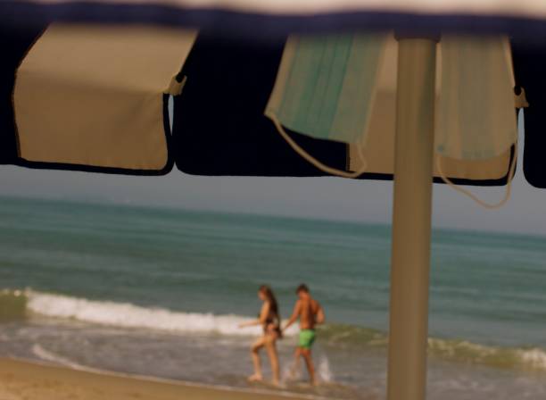 istock Masks under the beach umbrella 1268286874