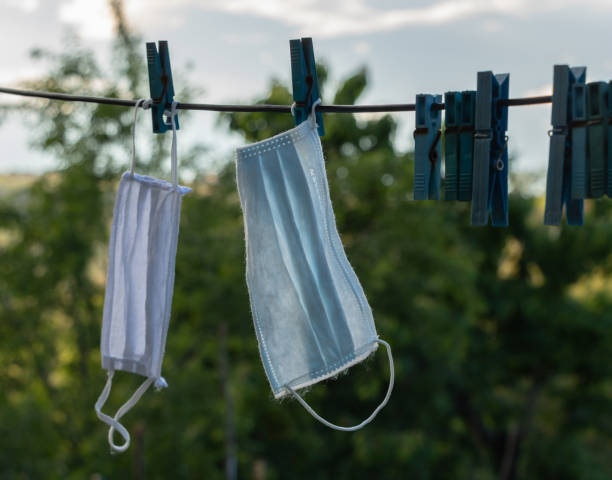 istock Used mask washed and put on the cable to dry. Coronavirus concept 1268288653