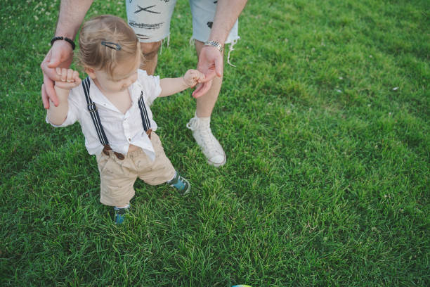 istock Firs step of baby boy in public park 1268290330