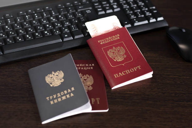 istock Russian documents. Passport. Workbook. Document for recording work experience. The inscription 