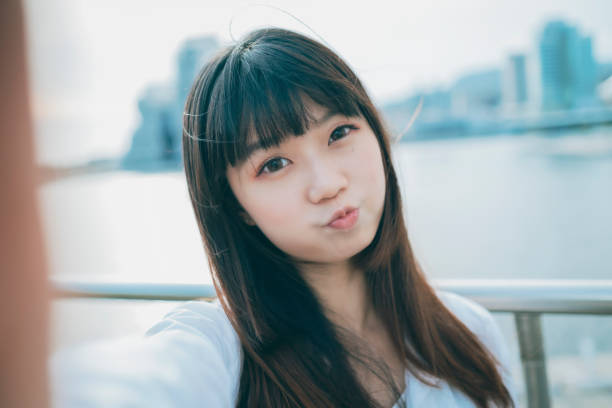 istock Asian woman smile take selfie 1268292299