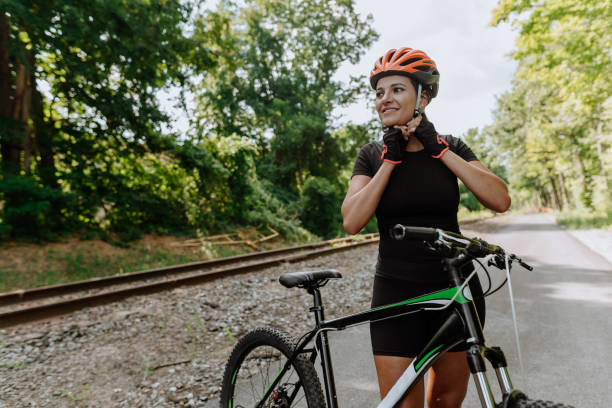 istock Woman getting ready for a bike ride 1268293933