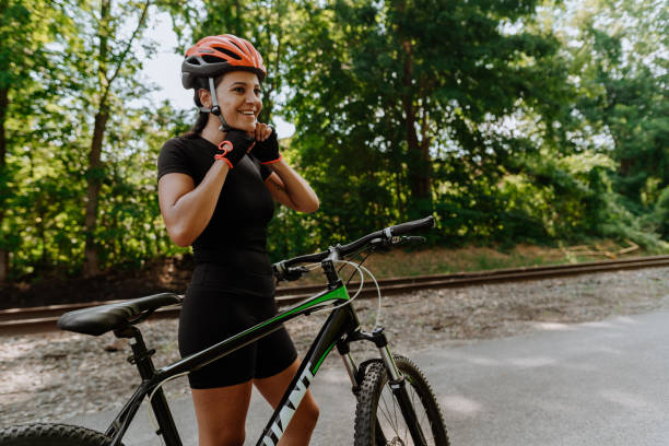 istock Woman getting ready for a bike ride 1268294456