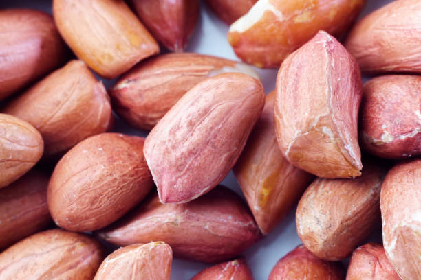istock peanuts for background and texture. peeled peanuts close up macro shot 1268295069