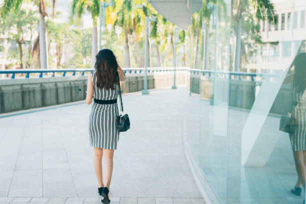 istock Busy businesswoman using smartphone in city 1268295162
