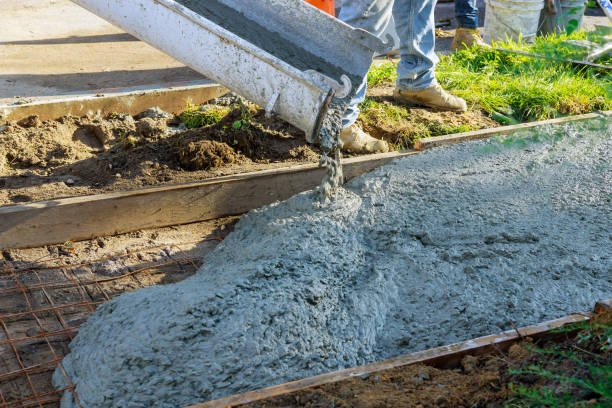 istock Construction of new sidewalks laying concrete cement 1268296538