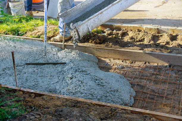 istock Construction process making of freshly poured cement new sidewalk in wet concrete 1268296541