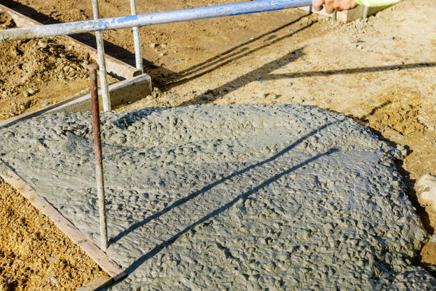 istock Construction of new sidewalks laying concrete cement 1268296553