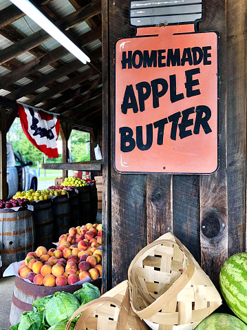 Vintage market advertises apple butter with large sign and i\ns filled with nostalgic and delicious items (in Meadows of Dan, Virginia) - selective focus