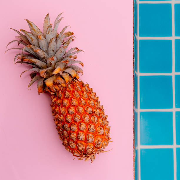istock Delicious yellow pineapple floating in a pool. Minimal 1268298906