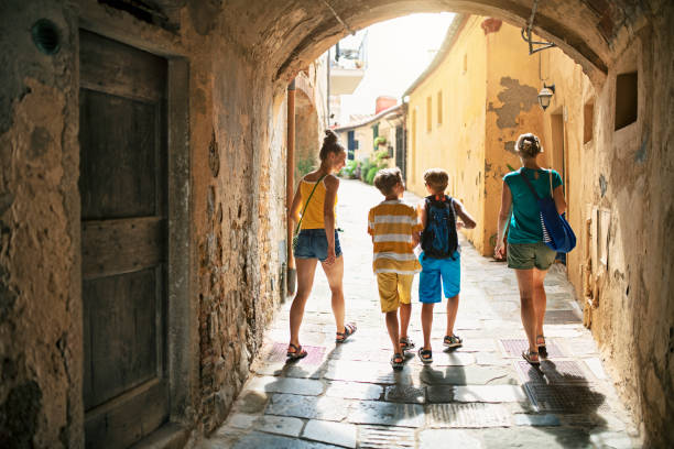 istock Family sightseeing beautiful Italian town 1268299067