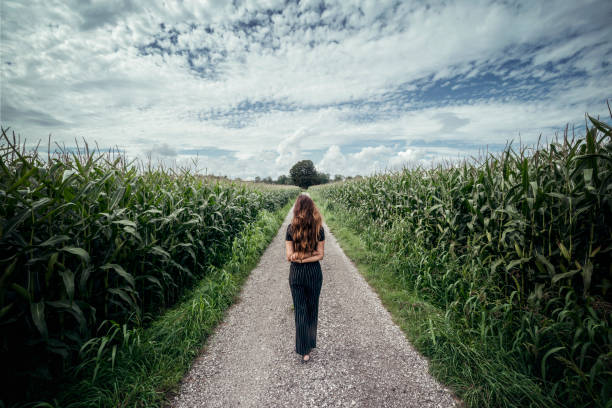 istock Beautiful woman walk on a long path 1268300111