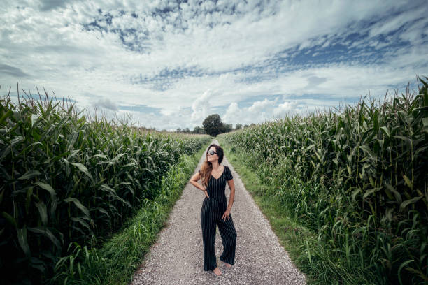 istock Beautiful woman walk on a long path 1268300302
