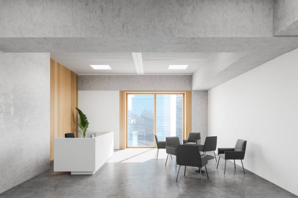 istock White and wood office with reception and armchairs 1268301957