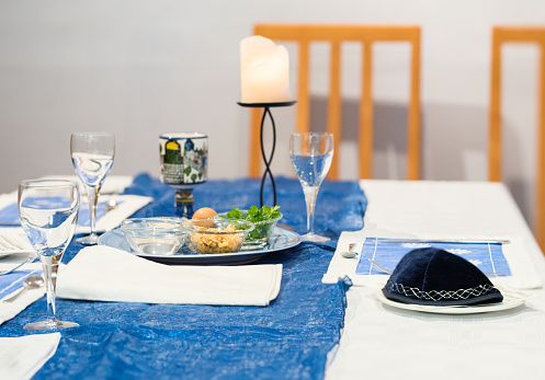 Dining room table set for traditional Jewish Seder meal