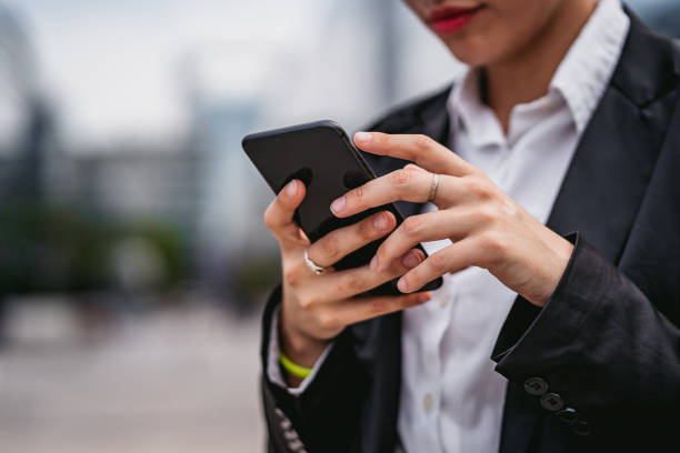 istock Young businesswoman reading online news on break 1268303351