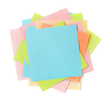 Top view of colorful sticky note papers isolated on white