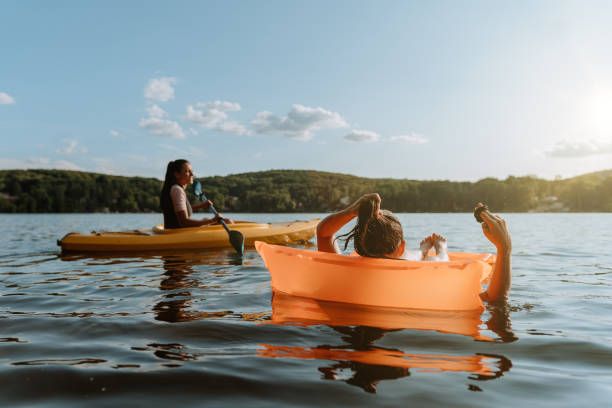 istock Friends enjoying moment at the lake in summer 1268304624